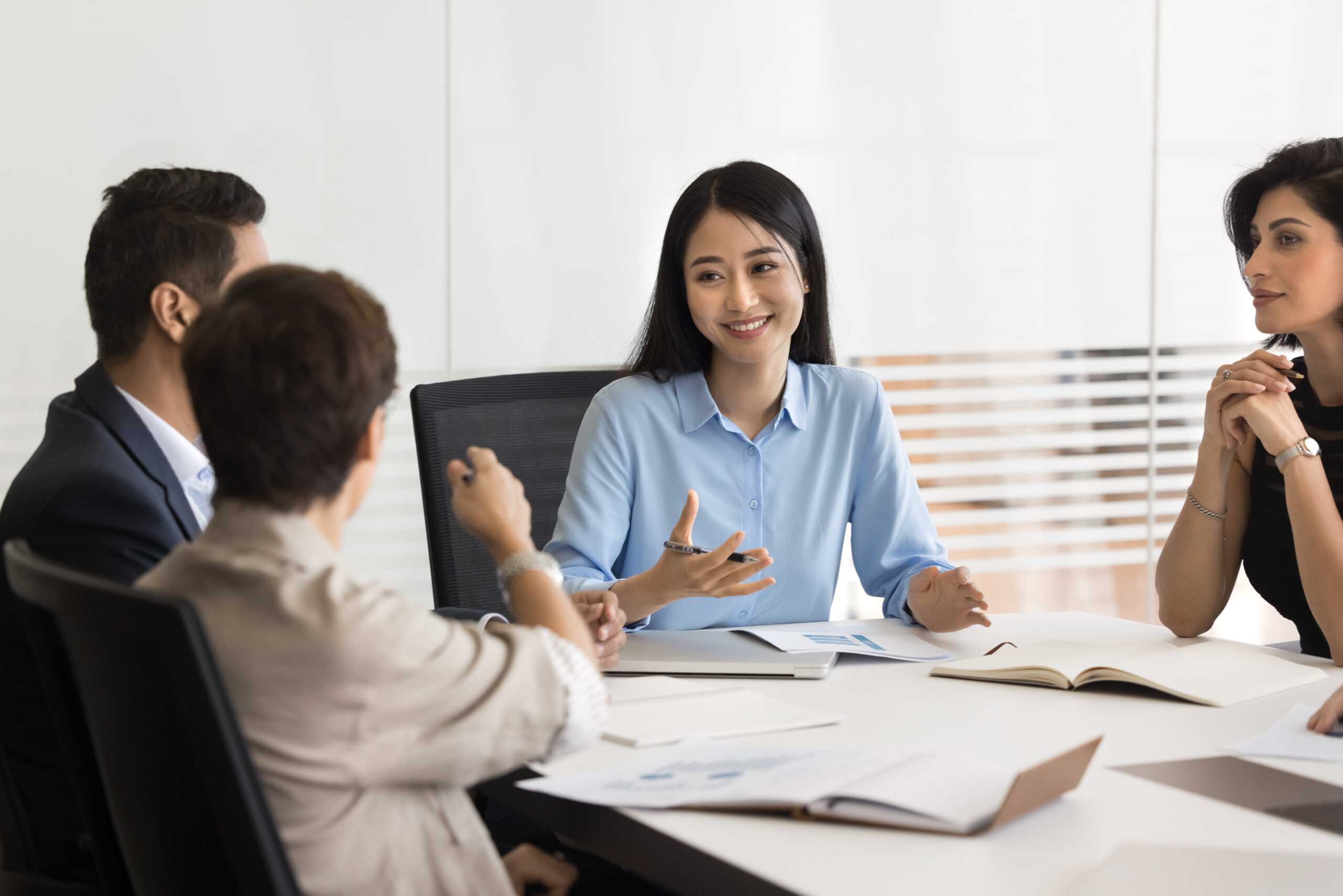 An group of workers discussing a topic promoting open dialogue culture.